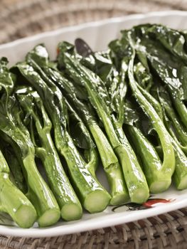 close up of stir fried kai-lan chinese broccoli