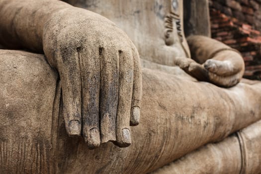 Buddha statue hand close up detail. Sukhothai, Thailand