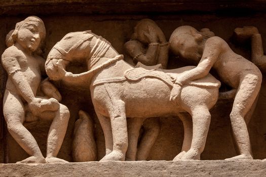 Famous erotic stone carving bas relieves, Lakshmana Temple, Khajuraho, India. Unesco World Heritage Site