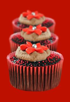 Delicious chocolate cupcakes in red