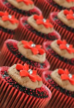 Delicious chocolate cupcakes in red