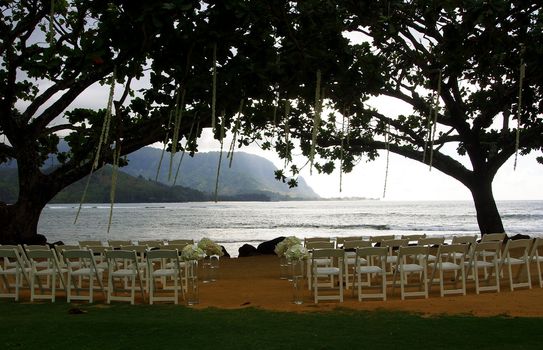 wedding ceremony set up on the beach at dusk