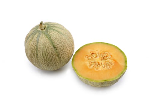 A melon opened with another one on a white background