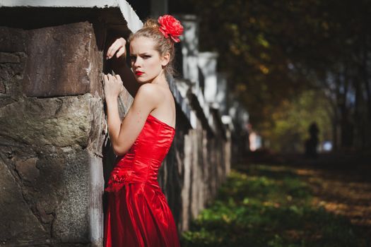 model, red, dress, flower, hair, park, view, lipstick, autumn, leaves, girl, trees, sun, wall, green, beauty, grace, stone, metal