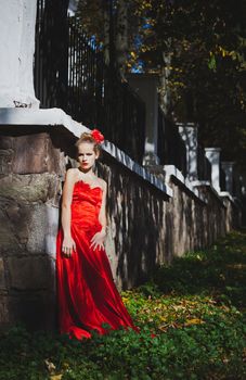 model, red, dress, flower, hair, park, view, lipstick, autumn, leaves, girl, trees, sun, wall, green, beauty, grace, stone, metal