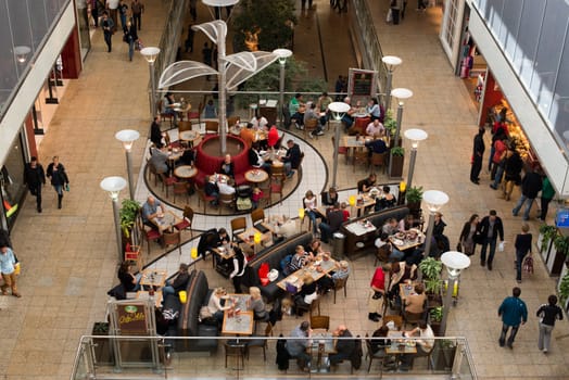 AUGSBURG – OCTOBER 20: People are shopping and resting in the City Galerie shopping mall on October 20,2012 in Augsburg, Germany. The mall was opened 2001 and is serving more than 20,000 people each day within its roughly 100 shops.