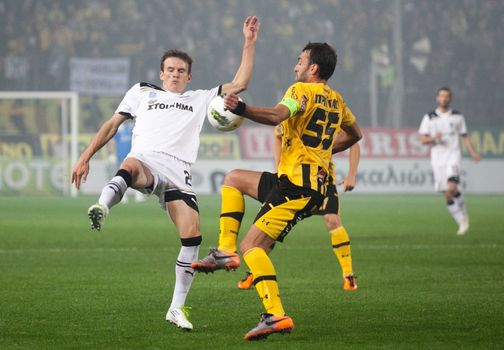 THESSALONIKI, GREECE - OCTOBER 23: Claiming the ball between players Sakis Prittas, Costin Lazar in football match between Paok and Aris (1-1) on October 23, 2011 in Thessaloniki, Greece