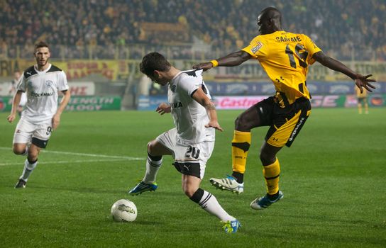THESSALONIKI, GREECE - OCTOBER 23: Claiming the ball between players Adelino Andre Vieirinha-Vieira, Khalifa Sankare in the match between Paok and Aris (1-1) on October 23, 2011 in Thessaloniki, Greece