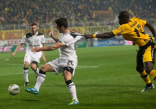 THESSALONIKI, GREECE - OCTOBER 23: Claiming the ball between players Adelino Andre Vieirinha-Vieira, Khalifa Sankare in the match between Paok and Aris (1-1) on October 23, 2011 in Thessaloniki, Greece