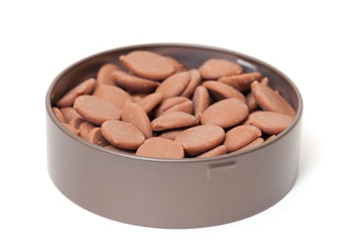 Chocolate Candies in tin can, on white background