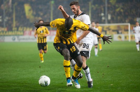 THESSALONIKI, GREECE - OCTOBER 23: Claiming the ball between players Apostolos Giannou, Khalifa Sankare in football match between Paok and Aris (1-1) on October 23, 2011 in Thessaloniki, Greece