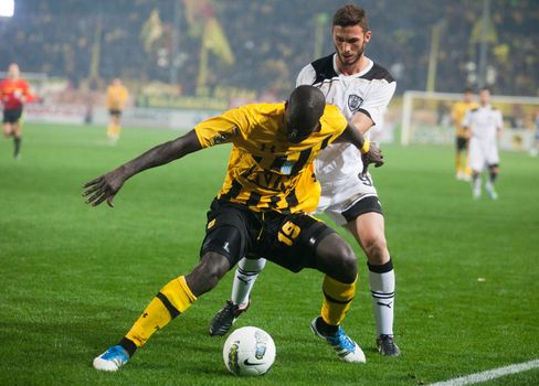 THESSALONIKI, GREECE - OCTOBER 23: Claiming the ball between players Apostolos Giannou, Khalifa Sankare in football match between Paok and Aris (1-1) on October 23, 2011 in Thessaloniki, Greece