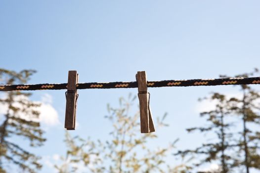 Clothespins on a line in a yard