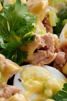 Background of Delicious Salad with Cod Liver, Quail Eggs and Parsley closeup