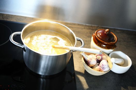 development of a recipe in a saucepan on the fire