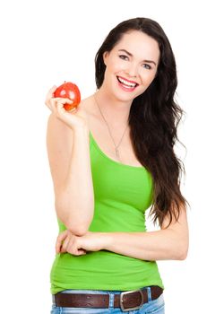 A happy healthy beautiful young woman smiling and holding an apple. Isolated on white.