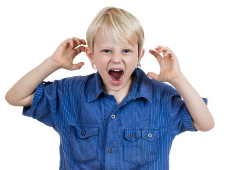 An angry frustrated young boy screaming. Isolated on white.