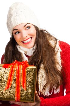 A happy beautiful smiling woman holding a beautifully wrapped Christmas gift. Isolated on white.