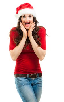 A beautiful happy surprised woman dressed in a red top and Santa hat. Isolated on white.