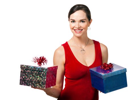 A beautiful happy woman holding two wrapped Christmas presents. Isolated on white.