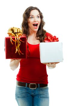 A beautiful happy and surprised  woman holding two beautifully wrapped Christmas gifts. Isolated on white.
