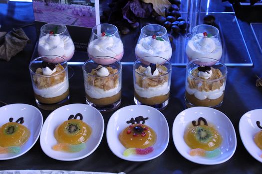 Colorful desserts and pastry served on a wedding party