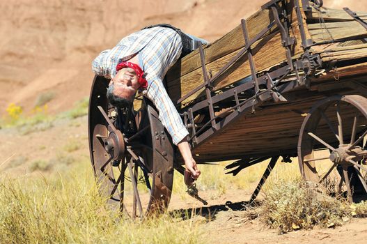 OUT WEST - A cowboy takes time to rest and reflect. 