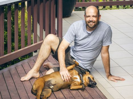 An image of a man and his dog