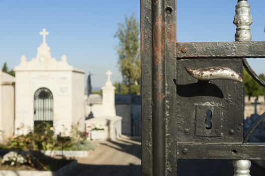 Detail of an iron gate at the entrance of a cemetery Portugal