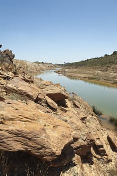 Detail of polluted riverbed of Mosteirao, downstream abandoned pyrite mine of S. Domingos , Mertola, Portugal