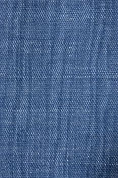 Blue denim background closeup with visible weave