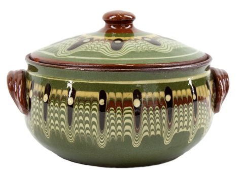 Traditional decorated glazed green clay pot on white