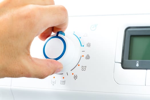 Hand Turning Washing Machine Appliance Dial