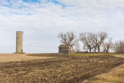 Abandoned Farmhouse and Silo on the Midwest Prairie