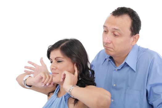 Portrait of a young woman gets earful from her husband against white background