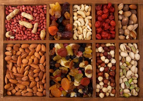 Arrangement of Dried Friits and Nuts in Wooden Box closeup top view