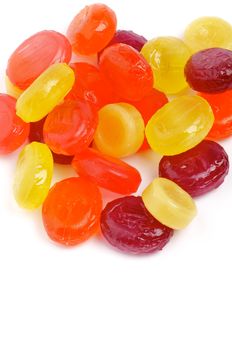 Heap of Multi Coloured Fruit Drops isolated on white background