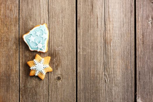 Christmas homemade gingerbread cookie over wooden table