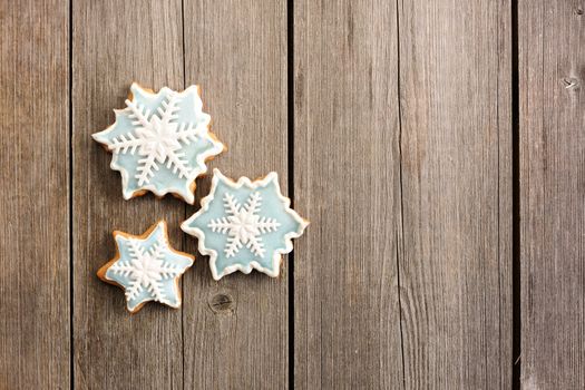 Christmas homemade gingerbread cookie over wooden table