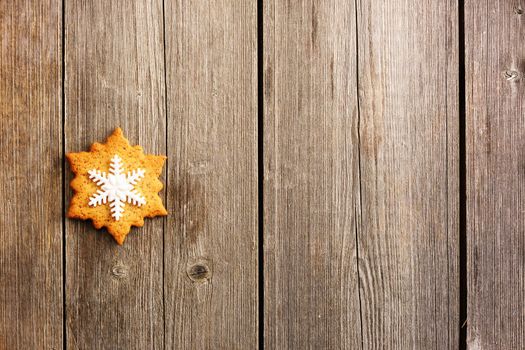 Christmas homemade gingerbread cookie over wooden table