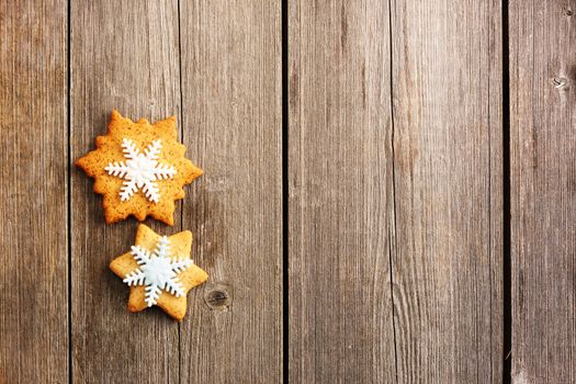 Christmas homemade gingerbread cookie over wooden table