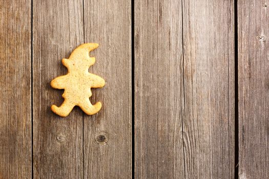Christmas homemade gingerbread cookie over wooden table