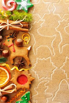 Christmas spices and cookies over homemade gingerbread dough