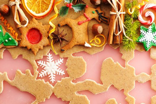Christmas spices and cookies over homemade gingerbread dough