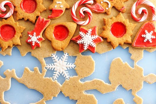Christmas homemade gingerbread cookies over dough