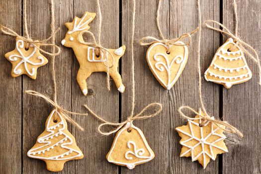 Christmas homemade gingerbread cookies over wooden table