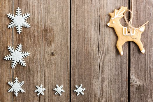 Christmas homemade gingerbread cookies over wooden table