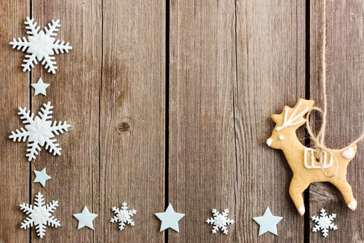 Christmas homemade gingerbread cookies over wooden table