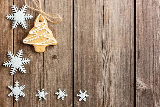 Christmas homemade gingerbread cookies over wooden table