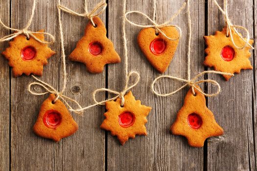 Christmas homemade gingerbread cookies over wooden table